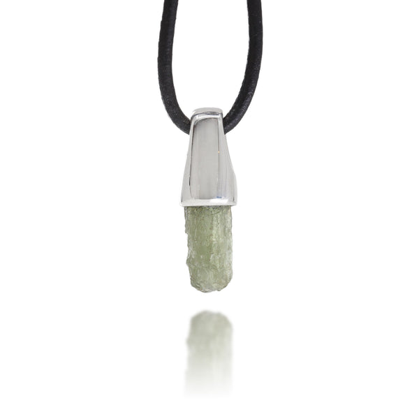 Necklace with a silver pendant and natural moldavite crystal on a white background
