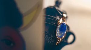 Lapis lazuli and bronze talisman pendant that represents Venus in Pisces. Photo: ©2025 Tristan Caron