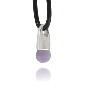 Necklace with a silver pendant and single purple grape agate on a white background