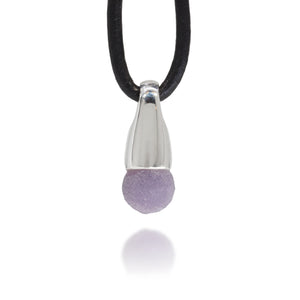 Necklace with a silver pendant and purple grape agate crystal on a white background