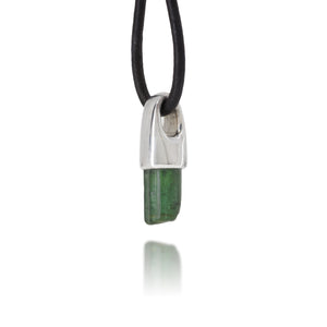 Necklace with a silver pendant featuring a green tourmaline stone on a white background