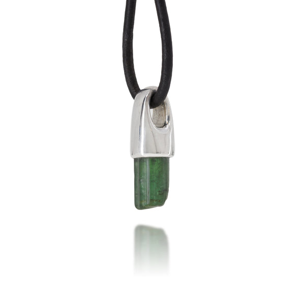 Necklace with a silver pendant featuring a green tourmaline stone on a white background