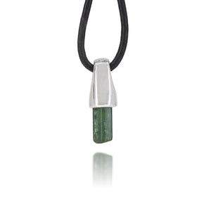 Necklace with a silver pendant and natural green tourmaline crystal on a white background