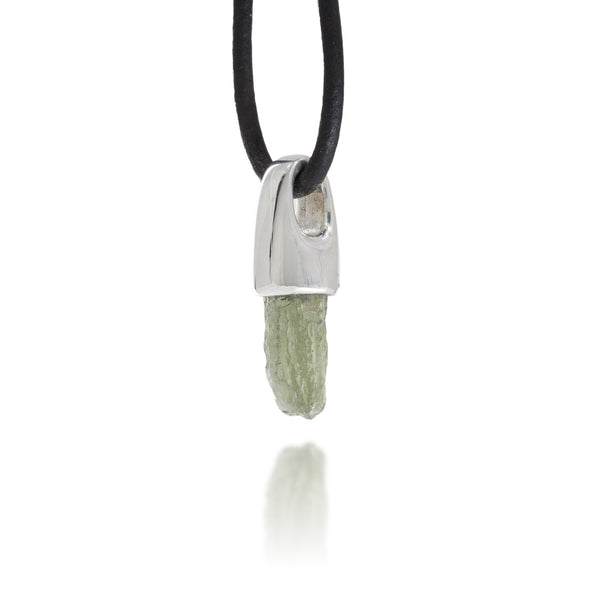 Necklace with a silver pendant and natural moldavite crystal on a white background