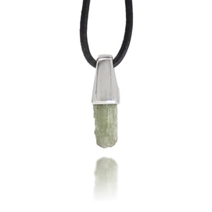 Necklace with a silver pendant and natural moldavite crystal on a white background
