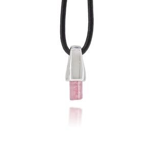 Necklace with a silver and pink tourmaline crystal pendant on a white background