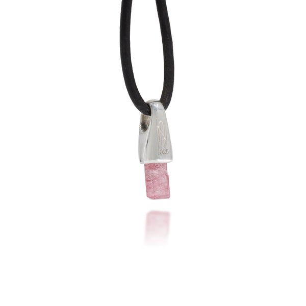 Necklace with a natural pink crystal and sterling silver pendant on a white background