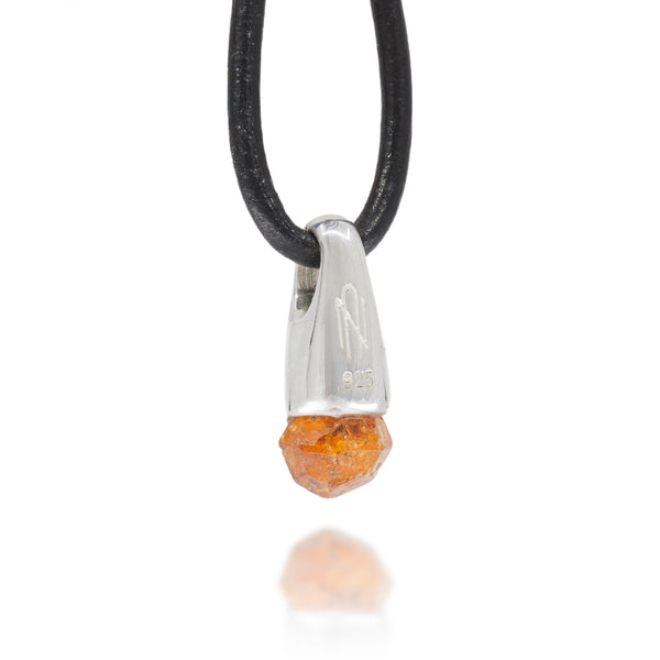 Back view of necklace with a silver and garnet crystal pendant showing the Astronumen logo and .925 engraving.