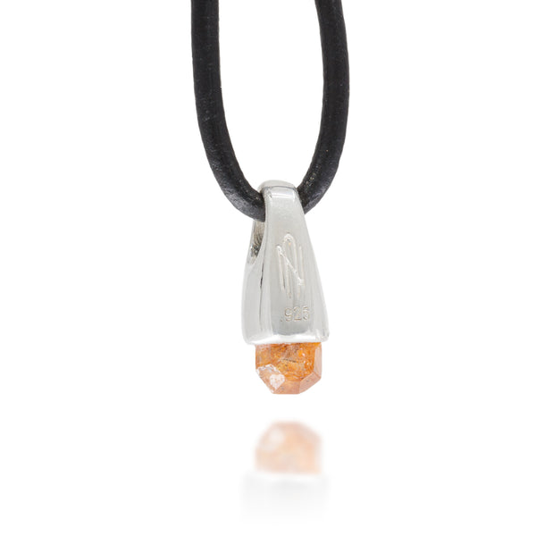 Back view of a necklace with a silver pendant featuring a orange garnet stone on a white background, with the astronumen logo and .925 etched into the metal
