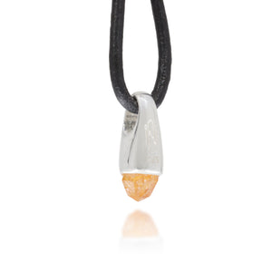 Necklace with a silver and orange crystal pendant on a black cord against a white background, with Astronumen logo and .925 etched into the pendant